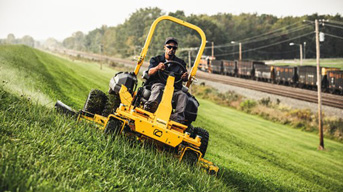 Cub Cadet yellow professional lawm mower cutting grass