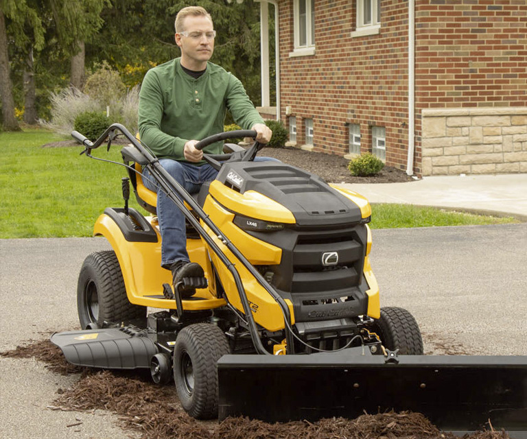 Riding lawn clearance tractor